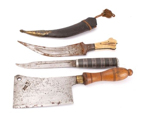 A 19th century jambiya, the short curved double edge blade with double fuller and floral chased ricasso, over a two piece bon