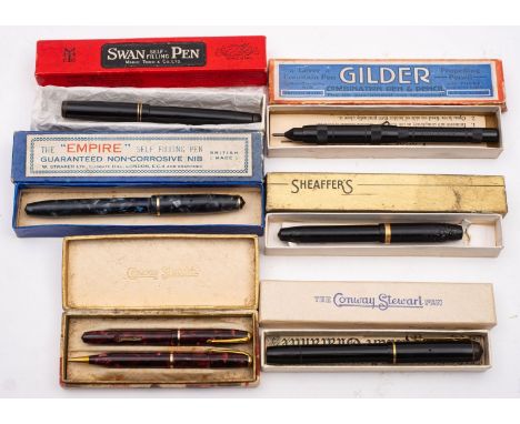 A Conway Stewart red marbled 6550 'Dinkie' fountain pen and propelling pencil set in original box: (lever to pen missing) tog