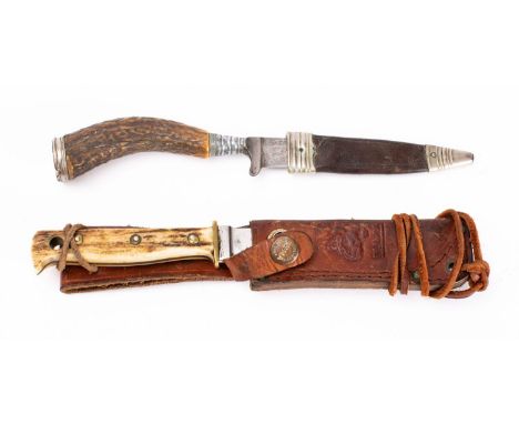 An early 20th century antler handled knife, the straight single edge clipped back blade with curved  grip and silver plated m
