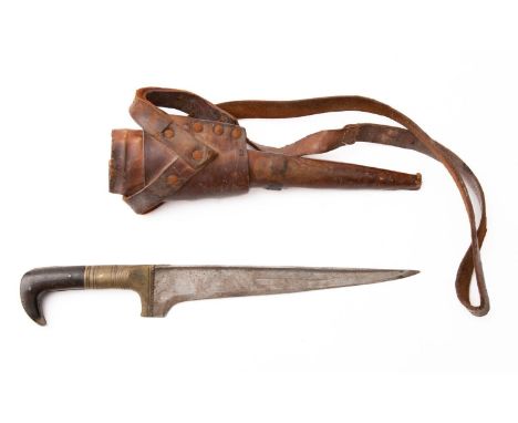 An early 20th century Indo Persian Pesh Kabz, the straight single edge blade over brass hilt with stamped concentric decorati
