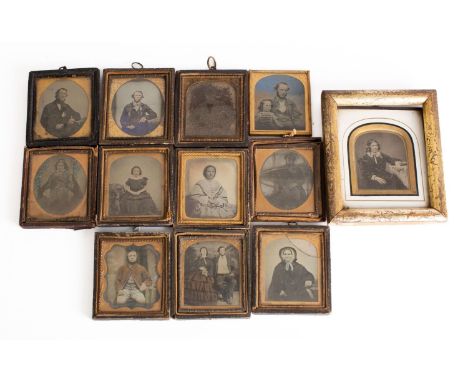 A collection of  twelve late 19th /early 20th century ambrotype portraits all unidentified sitters, one with manuscript date 