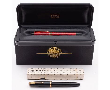 Parker Duofold. A cased red marbled fountain pen: gilt clip and double banded cap, platinum mounted 18k gold nib, together wi