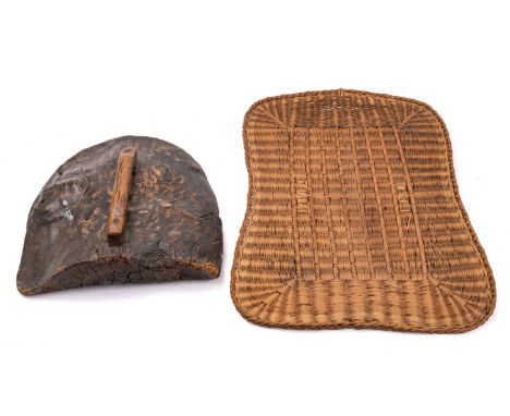 An elm fire cowl, possibly 18th century,  of domed form with square section handle, 45cm x 41cm, together with a later wicker
