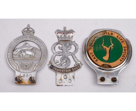 Three Car Mascot Badges.  A chromed ' Royal East African Automobile Association, no. L 560', a Kenyan ' East African Wild Lif
