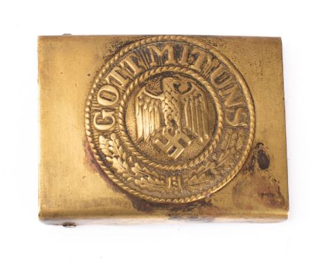 A German Army belt buckle, brass with eagle and legend to centre. 
