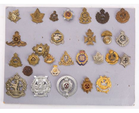A collection of Canadian Regimental cap badges, including Ontario Regiment, Royal Canadian Ordnance Corp, Saskatoon Light Inf