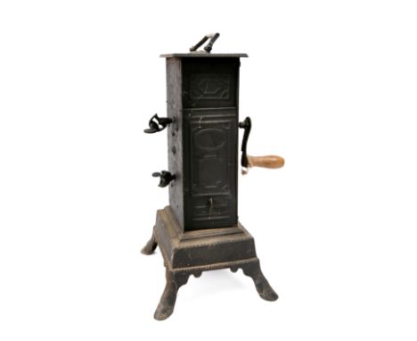 A 19th Century Continental clockwork spit engine in blackened tin and metal oblong casing, with winding handle, on four splay
