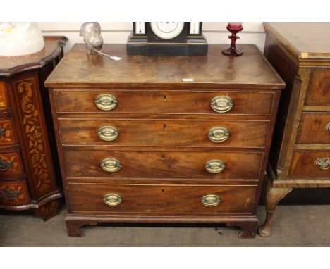 A George III mahogany and chequer banded chest, fitted four long graduated drawers, raised on bracket feet, 90cm wide