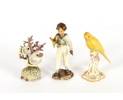 A Royal Worcester porcelain figure, "The Parakeet"; a Worcester figure "Four eyed Fish"; and another of a canary seated on a 