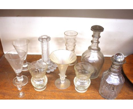 A pair of cut and etched glass thistle shaped beakers; two Victorian decanters; a cut glass candlestick and various other gla