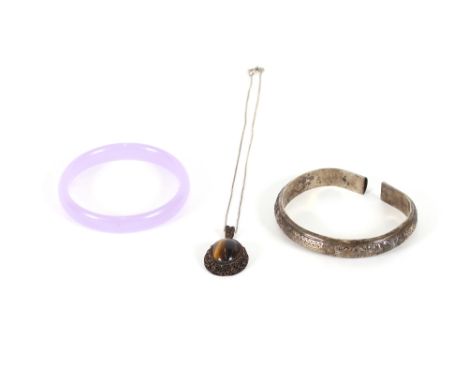 A Chinese chased Vintage white metal cuff, with two character mark; together with a lavender jadeite bangle and a filigree wo