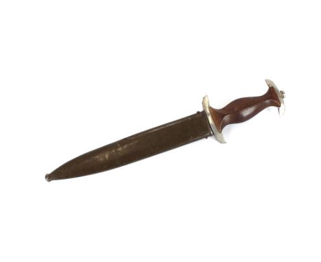 A German dagger, the blade inscribed "Karlburgs Muller, Berlin", complete with metal scabbard, 37cm long overall