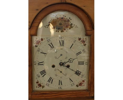 A stripped pine long case clock,&nbsp; having&nbsp;painted dial and 8 day movement