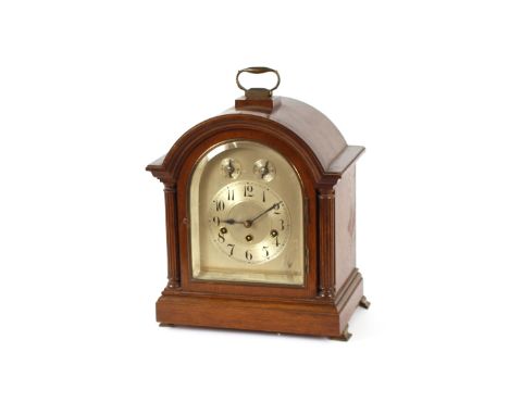 An Edwardian chiming mantel clock, having silvered dial