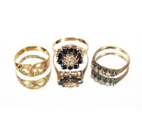 A 9 carat gold diamond and sapphire set ring, approx. 3gms; an 18 carat gold and diamond set ring, AF, approx. 2gms; and an 1