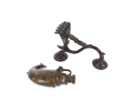An unusual Middle Eastern 19th Century bronze flask, in the form of a fish and an unusual bronze lamp decorated with five hea