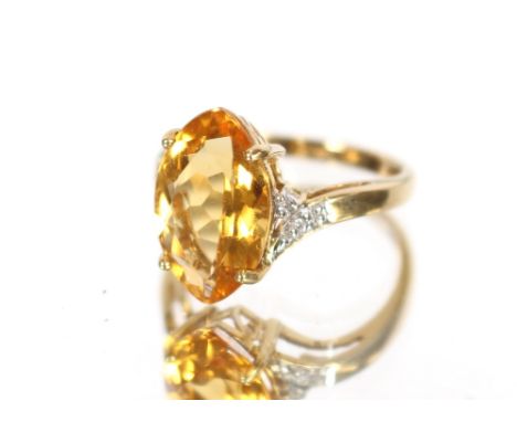 An Art Deco silver green stone ring; and a large citrine 9 carat gold mounted ring, size N, (2)