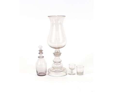 A Georgian glass baluster storm lamp, of large proportions, 41.5cm high; a small glass decanter and stopper; a dram glass and