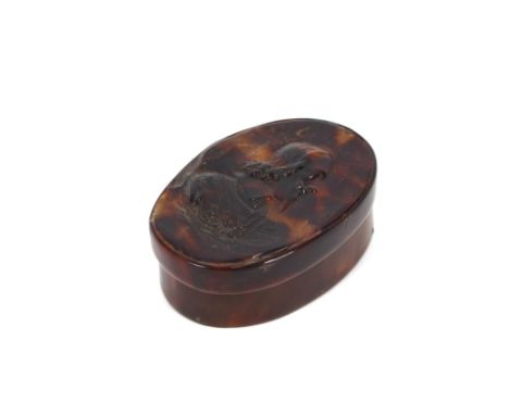 A rare 17th Century snuff box, of oval shape, the tortoiseshell lid moulded with a portrait of King Charles I, 7.3cm long