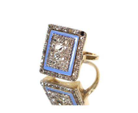 A large yellow metal, enamel and diamond set dress ring, (stone missing)