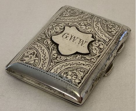 An antique silver cigarette case with floral decoration throughout and initialled cartouche.  Engraved with G.W.W. Silver gil