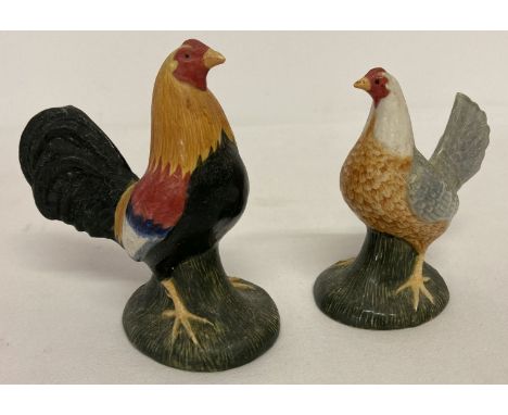 A ceramic cockerel and hen shaped salt and pepper cruet by Quail ceramics.  Salt pot approx. 12cm tall.