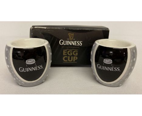 A pair of Guinness rugby ball ceramic egg cups complete with original box.  