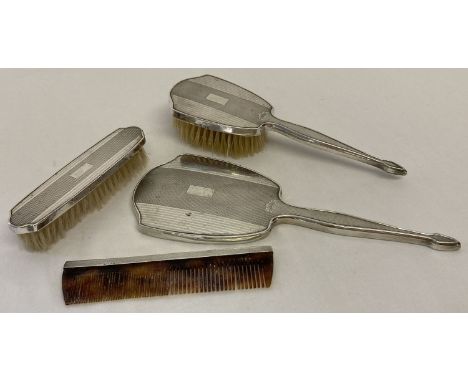 A vintage silver backed dressing table set by Mappin &amp; Webb, hallmarked Birmingham 1963.  Comprising: Hand mirror, hair b