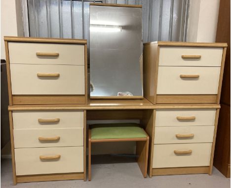 A 1980's light wood and cream dressing table and matching mirror and bedside cabinets.  Together with a green velour toped dr