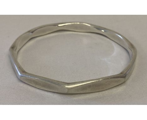 A heavy silver octagonal shaped bangle. Hallmarked Birmingham 1997.   Total weight approx. 39.2g.