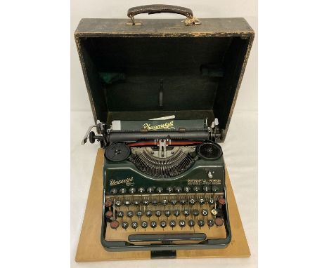 A vintage German Rheinmetall Borsig typewriter in green with gold decals.  With wooden lockable carry case, complete with key