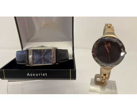 2 ladies wristwatches. A boxed watch by Accurist with square silver tone case and leather strap.  Together with a Calvin Klei