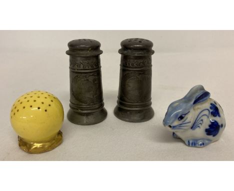 A collection of vintage cruets. A pewter cruet set with floral decoration.  Together with a Delft style ceramic rabbit salt p