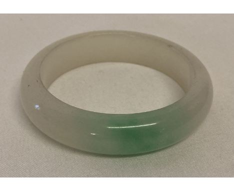A chunky Chinese jade bangle with flat interior and rounded exterior.   Approx. 8cm diameter, with 6cm inner diameter.