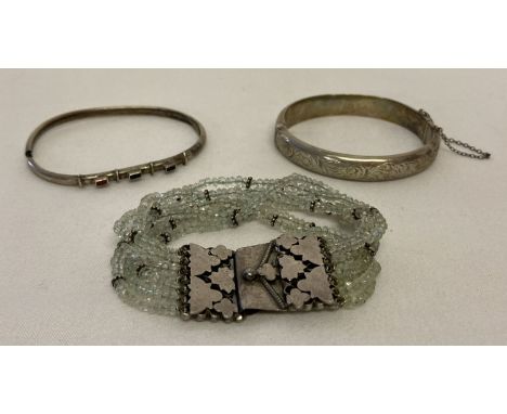 3 vintage silver bracelets. A glass chip stranded bracelet with large decorative silver clasp.  Together with a vintage hinge