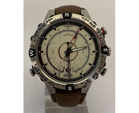 A men's Indiglo Intelligent quartz watch T2N721 by Timex.  Cream coloured face with brown leather strap. Water resistant up t
