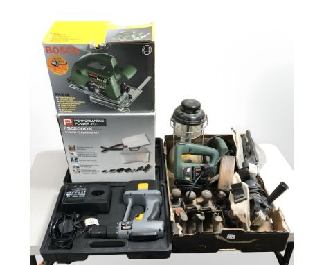 A group of power tools including : Bosch circular saw, Performance Power steam cleaning kit, vintage wood working planes, oil