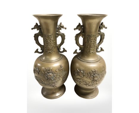 A pair of Chinese bronze twin handled vases, height 30.5 cm.