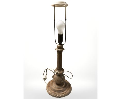 A turned and carved oak lamp base, height 68 cm. (continental plug)