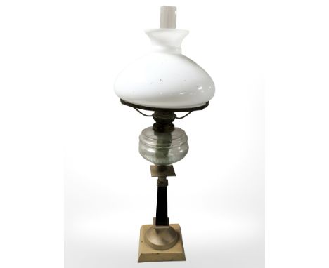 A brass and glass oil lamp, height 71 cm.