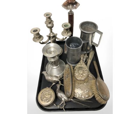 A group of pewter tankards and candlestick, EPNS candlesticks, dressing table brushes, two models of pheasants, etc.