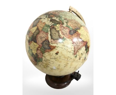 A plug in terrestrial globe, height 40 cm.