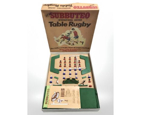 A Subbuteo international edition table rugby game.