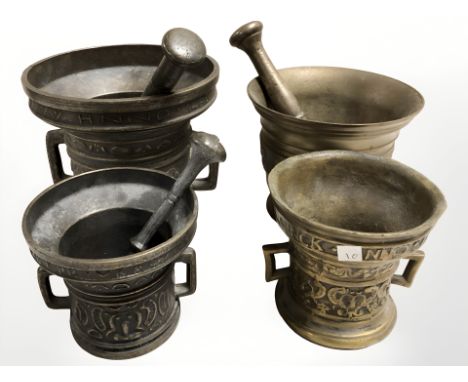 Four bronze mortars and pestles, tallest 13 cm.