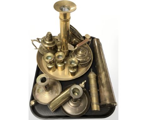 Brass wares including a large ejector chamber stick, further candlesticks, inert ammunition shell, etc.