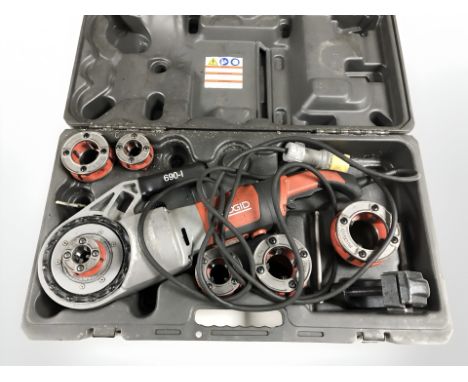 A Ridgid 690-1 handheld pipe threading tool, boxed.