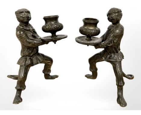 A pair of bronze figural monkey candlesticks, height 16cm. 