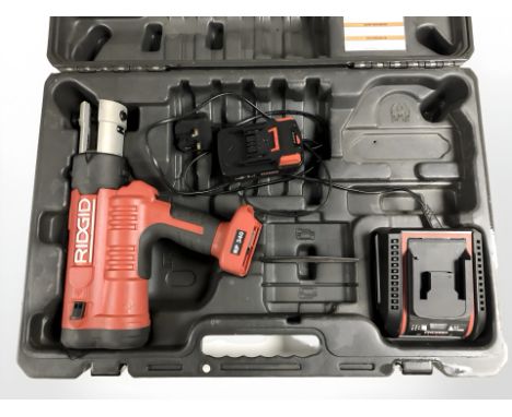 A Ridgid RP340 press tool, with Strutslayr strut shearhead, charger, instructions, etc. (2 cases)