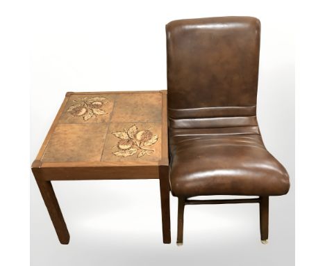 A teak tiled inset lamp table on castors and a brown vinyl chair 