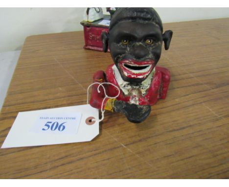  Sale Item:    MAN CAST IRON BANK   Vat Status:   No Vat   Buyers Premium:  This lot is subject to a Buyers Premium of 15% + 